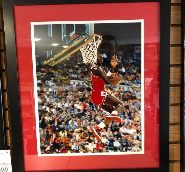 Framed autographed Michael Jordan slam dunk photograph