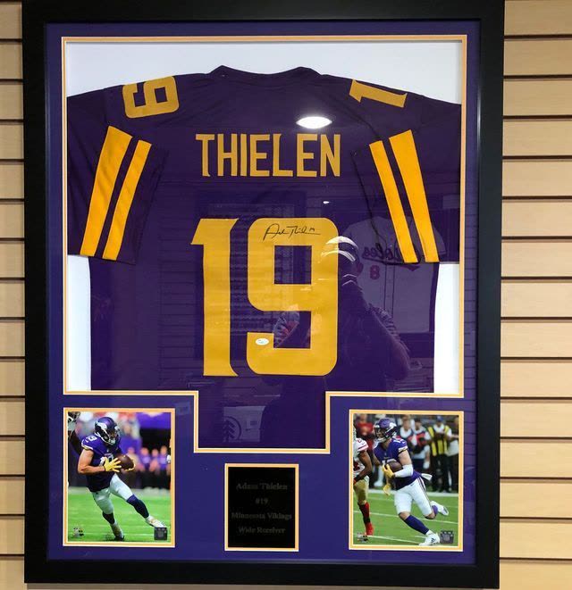 Framed autographed Adam Thielen Minnesota Vikings number 19 jersey