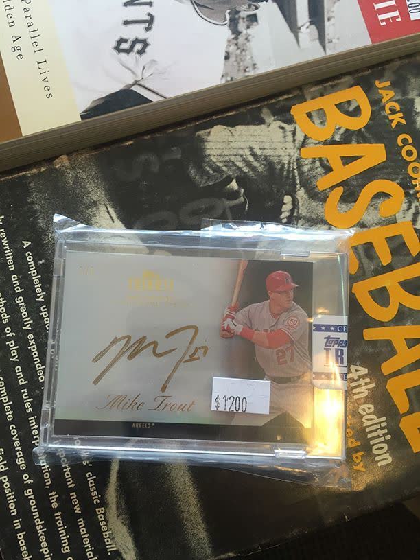 Autographed Mike Trout Topps baseball card in a protective holder