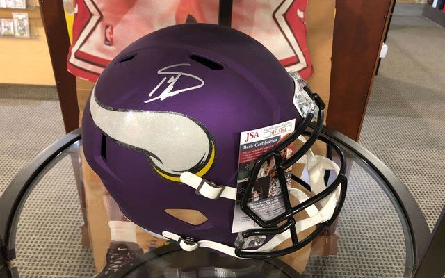 Autographed Minnesota Vikings helmet with JSA certificate of authenticity
