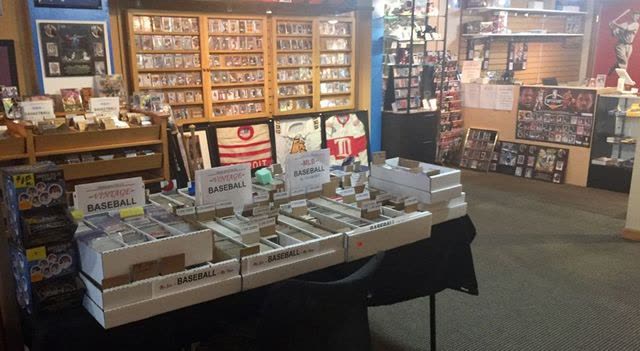 Tables of sorted baseball cards in boxes