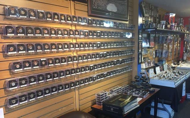 Wall of framed, signed collectibles